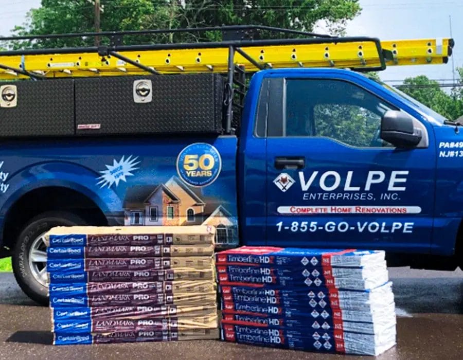 A Volpe Enterprises truck arrives at a home with roofing materials. A Volpe Enterprises truck arrives at a home with roofing materials.